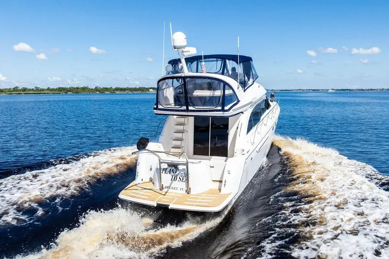  Yacht Photos Pics 2008 Meridian 411 Sedan cruising on open water under a clear blue sky.