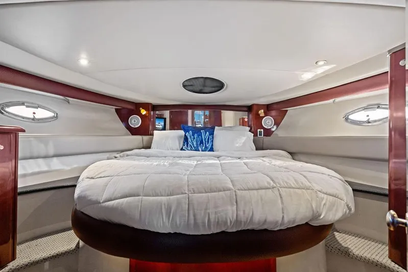  Yacht Photos Pics Luxurious bedroom interior of 2008 Meridian 411 Sedan yacht with plush bedding and elegant design.