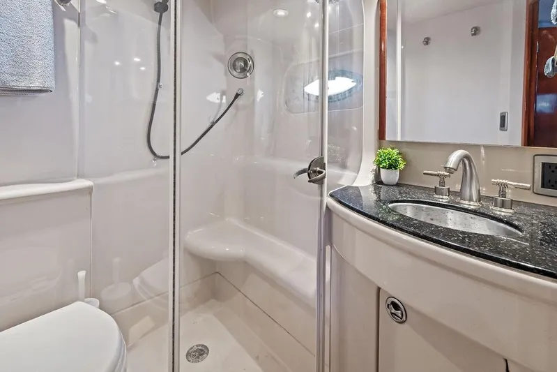 Yacht Photos Pics Luxurious bathroom in 2008 Meridian 411 Sedan yacht with modern fixtures and shower.