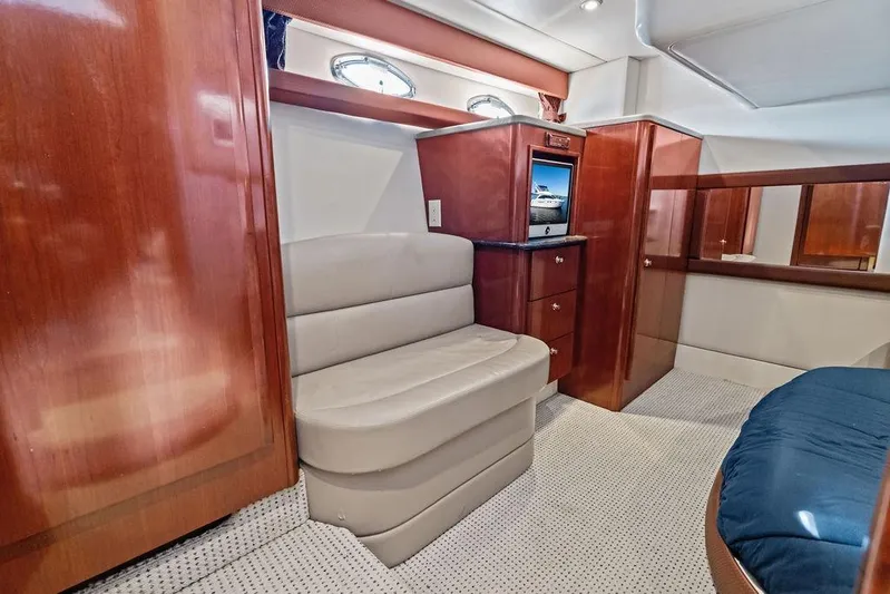  Yacht Photos Pics Luxurious interior of 2008 Meridian 411 Sedan yacht with wood paneling and seating.