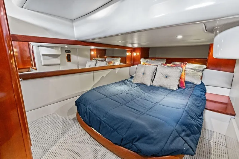  Yacht Photos Pics Luxurious 2008 Meridian 411 Sedan cabin with cozy bed and elegant wood accents.