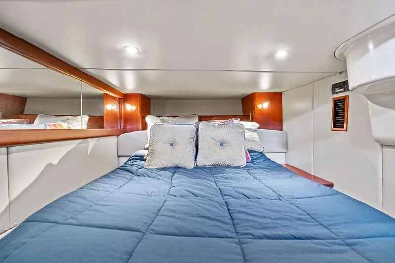  Yacht Photos Pics Luxurious cabin interior of 2008 Meridian 411 Sedan with cozy bedding and ambient lighting.