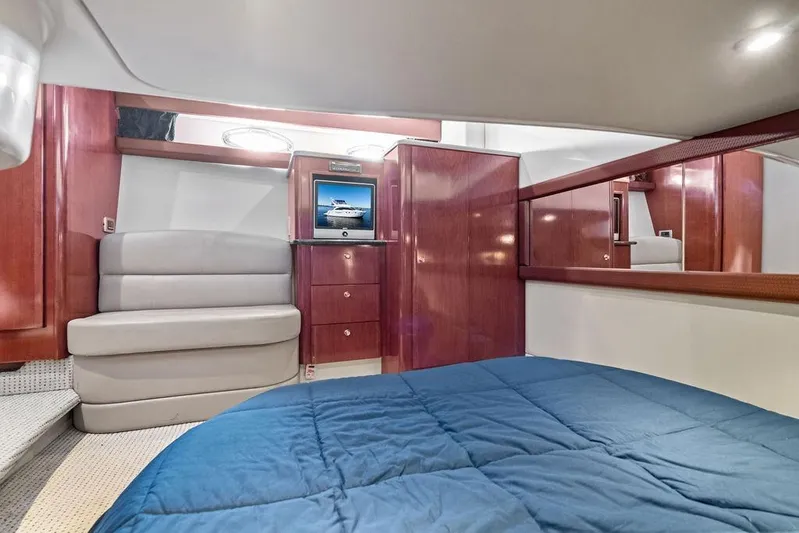  Yacht Photos Pics Luxurious interior of 2008 Meridian 411 Sedan yacht with wood paneling and cozy seating.