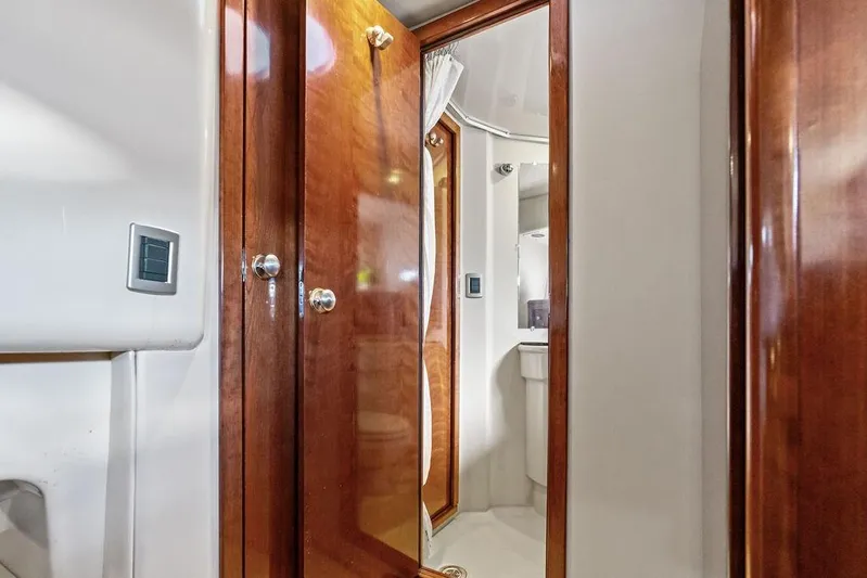  Yacht Photos Pics Interior of 2008 Meridian 411 Sedan yacht with wooden doors and bathroom view.