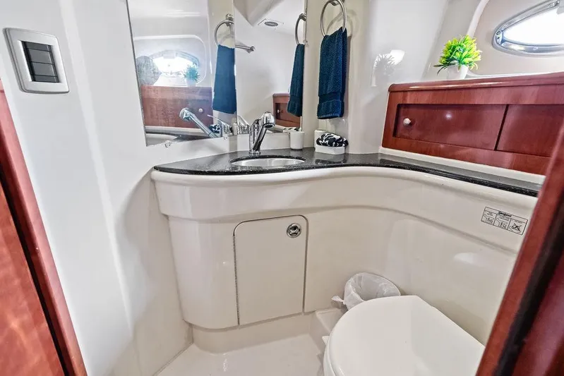  Yacht Photos Pics Luxurious bathroom in 2008 Meridian 411 Sedan yacht with modern fixtures and elegant wood accents.