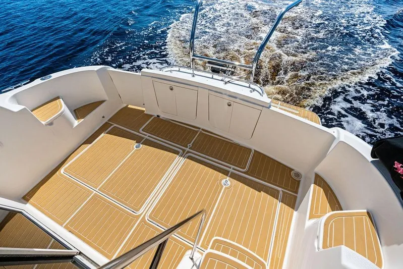  Yacht Photos Pics 2008 Meridian 411 Sedan boat deck with teak flooring, cruising on open water.