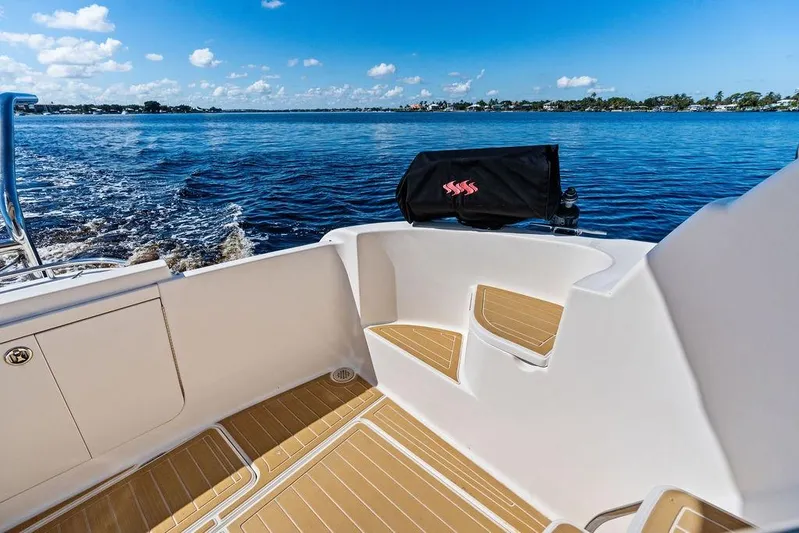  Yacht Photos Pics 2008 Meridian 411 Sedan boat deck with scenic ocean view and clear blue sky.