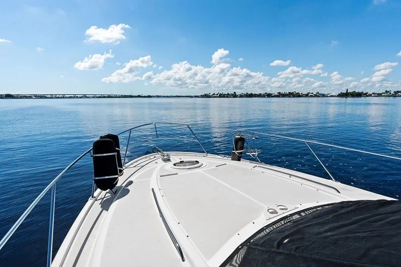  Yacht Photos Pics 2008 Meridian 411 Sedan yacht cruising on calm blue waters under a clear sky.