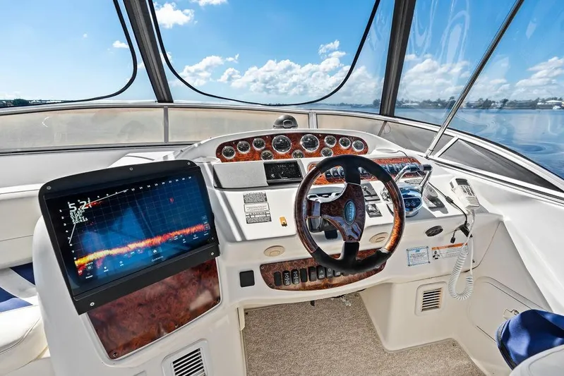  Yacht Photos Pics 2008 Meridian 411 Sedan helm with advanced navigation system and luxurious wood accents.