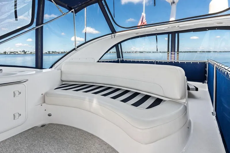  Yacht Photos Pics 2008 Meridian 411 Sedan yacht interior with white seating and panoramic water view.