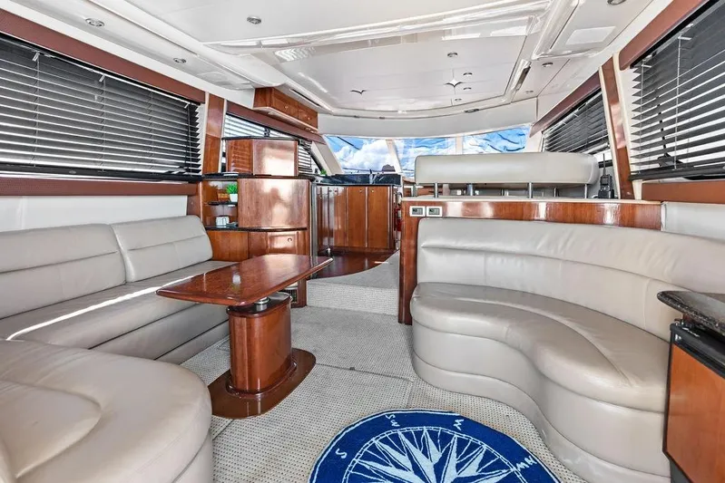  Yacht Photos Pics Luxurious interior of 2008 Meridian 411 Sedan yacht with leather seating and wooden accents.