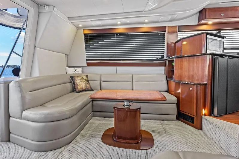  Yacht Photos Pics Luxurious interior of 2008 Meridian 411 Sedan yacht with leather seating and wooden accents.