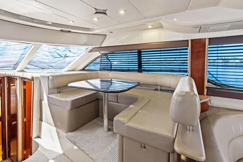  Yacht Photos Pics Luxurious interior of 2008 Meridian 411 Sedan yacht with elegant seating and panoramic windows.
