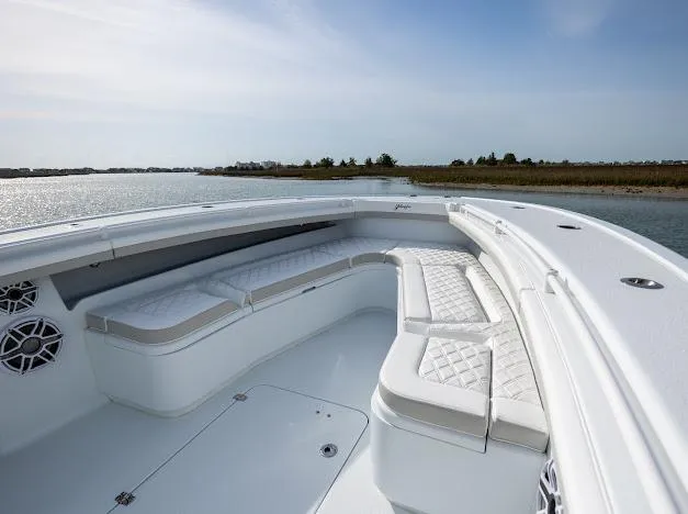  Yacht Photos Pics 2025 Yellowfin 34 Offshore boat with spacious seating on calm water.