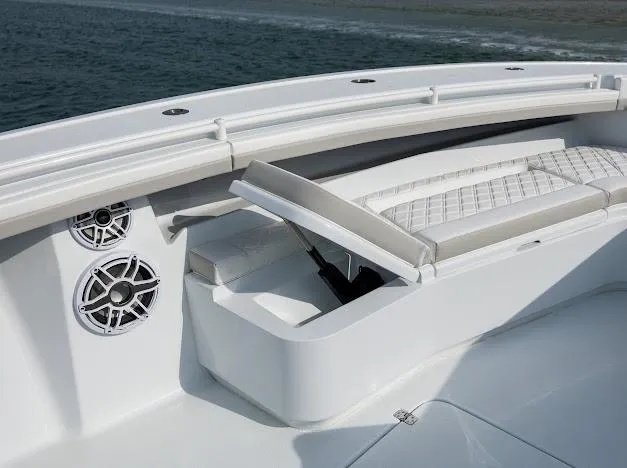  Yacht Photos Pics 2025 Yellowfin 34 Offshore boat interior with cushioned seating and built-in speakers.