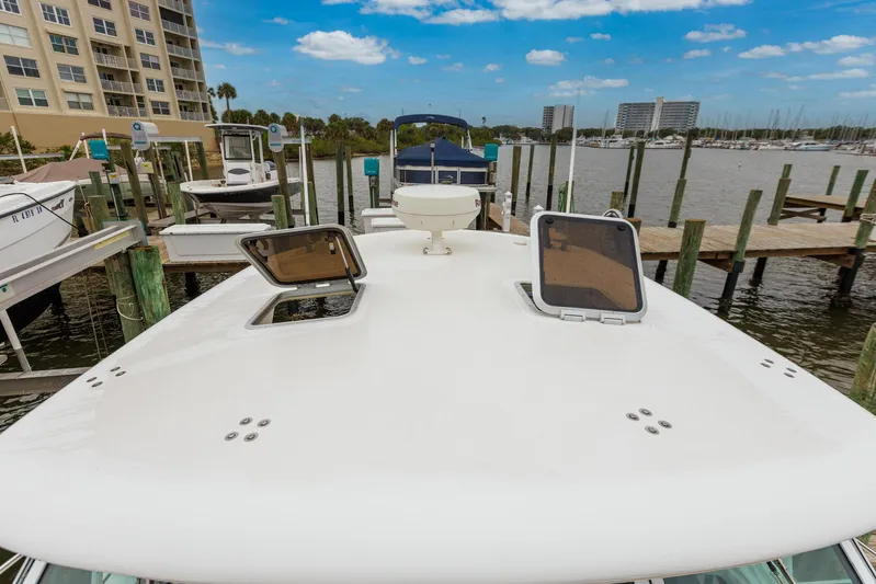 Last Call Yacht Photos Pics 2001 Tiara Yachts 3500 Open docked, featuring open hatches and marina view.