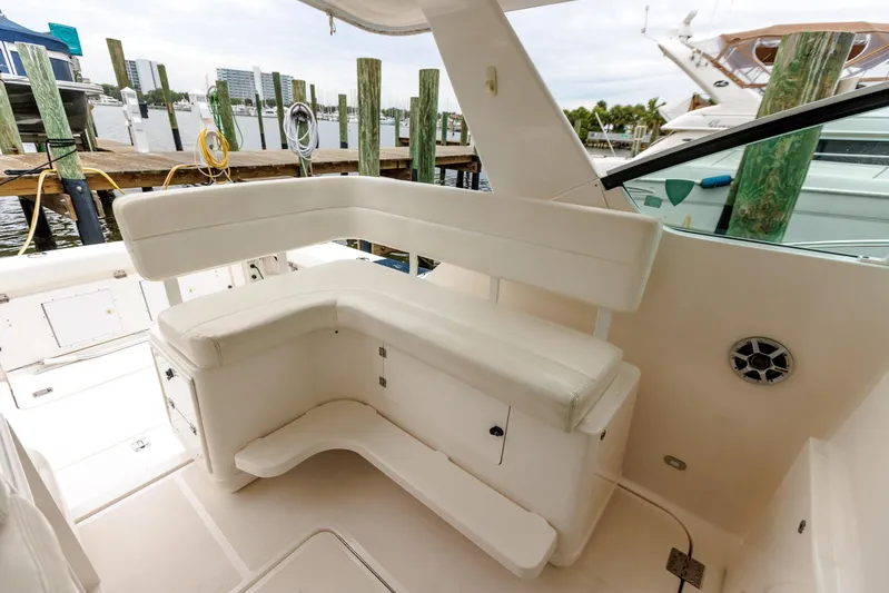 Last Call Yacht Photos Pics 2001 Tiara Yachts 3500 Open interior with white seating and dock view.