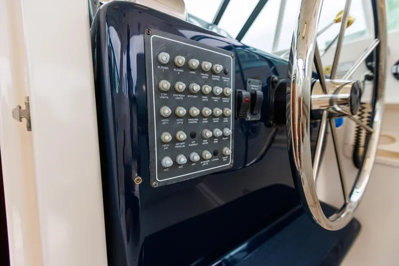 Last Call Yacht Photos Pics Control panel and steering wheel of a 2001 Tiara Yachts 3500 Open boat.
