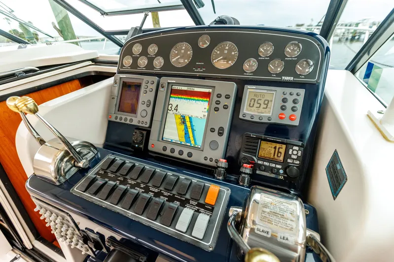 Last Call Yacht Photos Pics Control panel of a 2001 Tiara Yachts 3500 Open, featuring navigation and engine instruments.