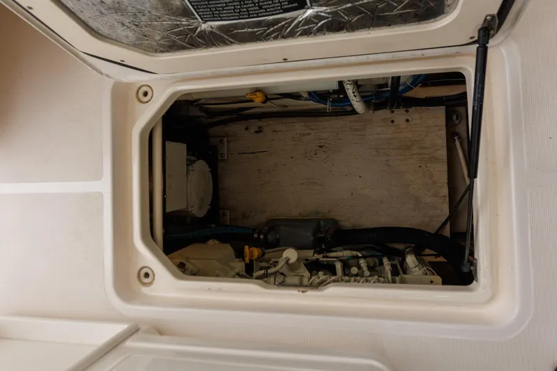 Last Call Yacht Photos Pics Engine compartment of a 2001 Tiara Yachts 3500 Open, showcasing mechanical components.