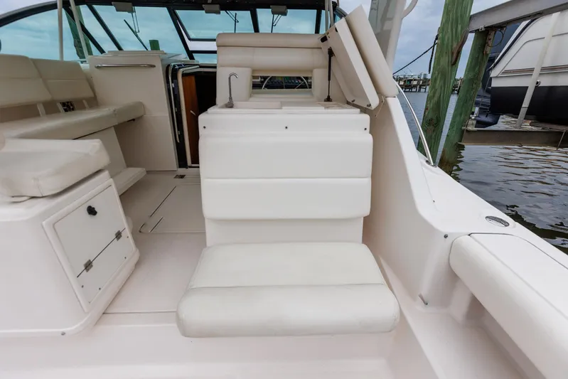 Last Call Yacht Photos Pics 2001 Tiara Yachts 3500 Open interior with white seating and dock view.