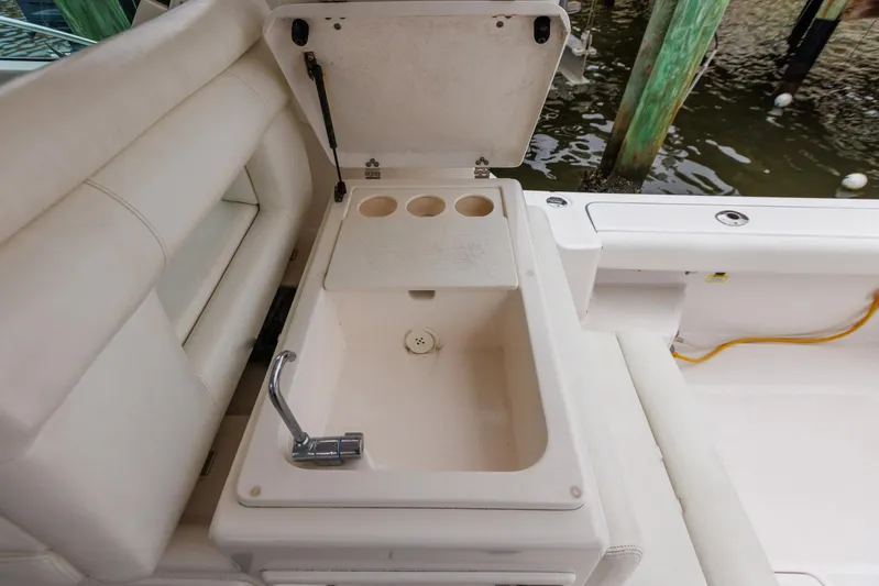 Last Call Yacht Photos Pics 2001 Tiara Yachts 3500 Open boat sink with faucet and cup holders.