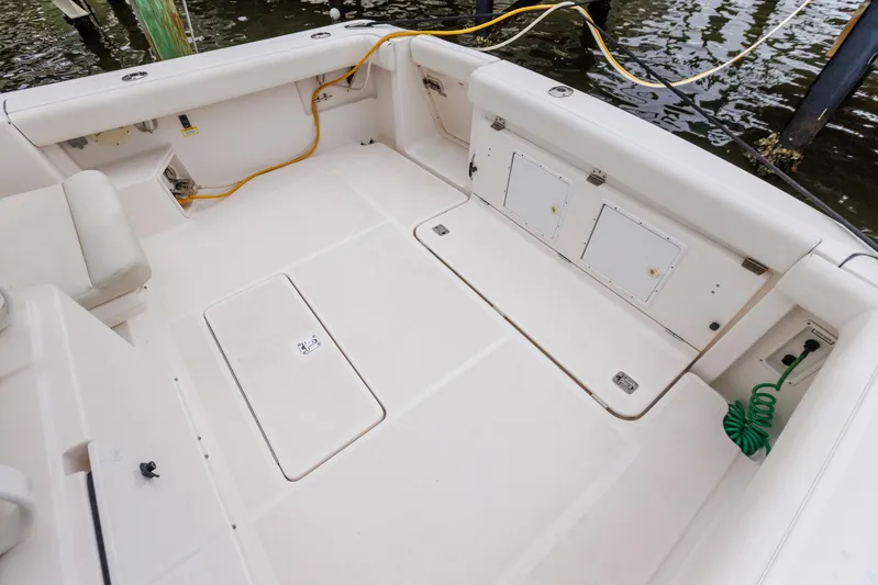 Last Call Yacht Photos Pics 2001 Tiara Yachts 3500 Open deck with storage compartments and utility connections.