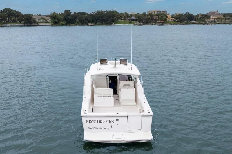 Last Call Yacht Photos Pics 2001 Tiara Yachts 3500 Open on water, rear view, "Knot Like This" name visible.
