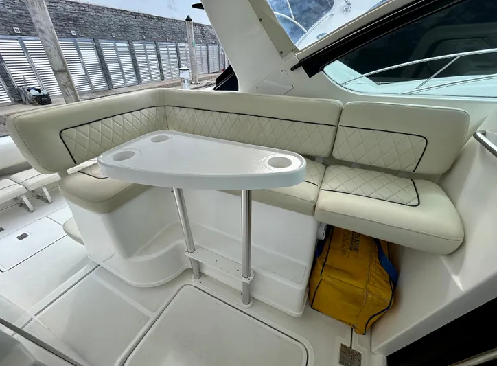 2006 Tiara 3600 Open @ Cancun Yacht Photos Pics 2006 Tiara Yachts 3600 Open interior with white cushioned seating and table.