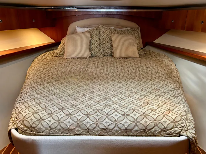 2006 Tiara 3600 Open @ Cancun Yacht Photos Pics 2006 Tiara Yachts 3600 Open cabin with cozy bed and wooden accents.