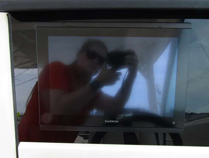  Yacht Photos Pics Garmin display on 2023 Sailfish 316 DC boat with reflection of person taking photo.
