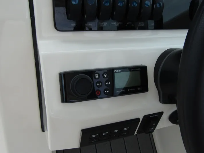  Yacht Photos Pics Control panel of 2023 Sailfish 316 DC boat with Fusion audio system.