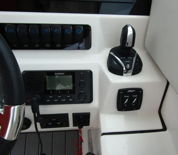  Yacht Photos Pics Control panel of 2023 Sailfish 316 DC boat with Garmin display and joystick.
