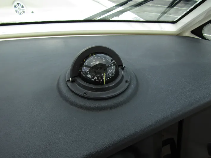  Yacht Photos Pics Compass on the dashboard of a 2023 Sailfish 316 DC boat.