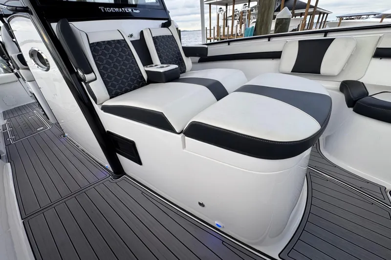 Sunset Chaser Yacht Photos Pics 2023 Tidewater 320 CC Adventure boat interior with sleek seating and modern design.