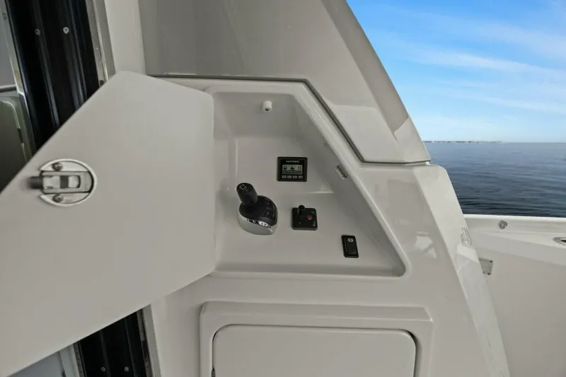 Be As You Are Xl Yacht Photos Pics Control panel on 2017 Prestige 680 Flybridge yacht, featuring joystick and switches, ocean view.