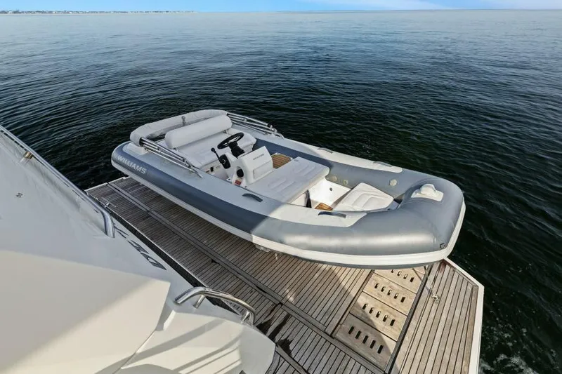 Be As You Are Xl Yacht Photos Pics Prestige 680 Flybridge 2017 yacht with tender on water, showcasing luxury marine design.