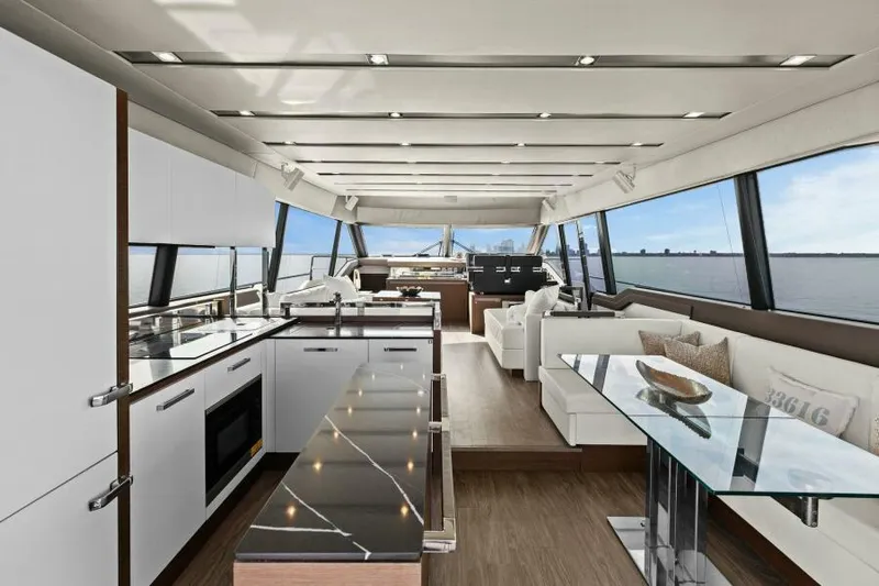 Be As You Are Xl Yacht Photos Pics Luxurious interior of 2017 Prestige 680 Flybridge yacht with modern kitchen and seating area.