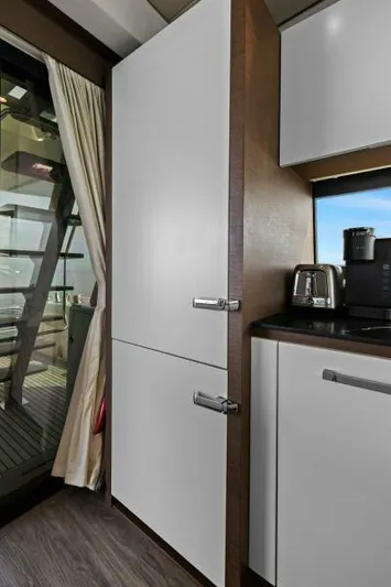 Be As You Are Xl Yacht Photos Pics Modern kitchen area on a 2017 Prestige 680 Flybridge yacht with appliances and cabinetry.