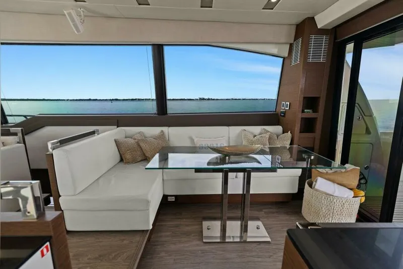Be As You Are Xl Yacht Photos Pics Luxurious interior of 2017 Prestige 680 Flybridge yacht with elegant seating and glass table.