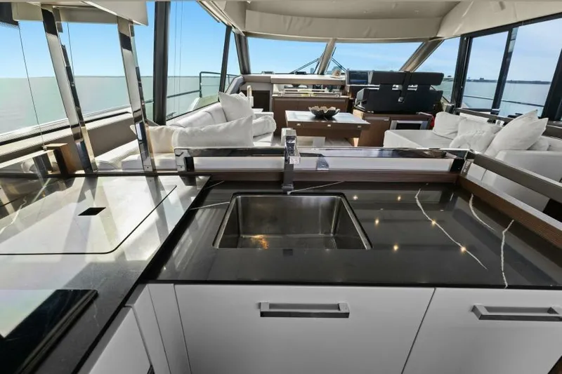 Be As You Are Xl Yacht Photos Pics Luxurious interior of 2017 Prestige 680 Flybridge yacht with modern kitchen and seating area.