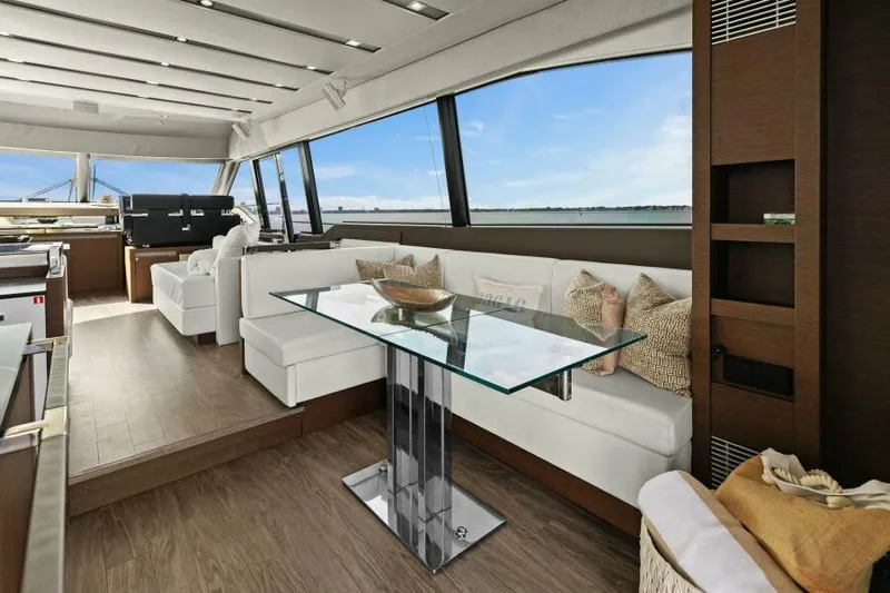 Be As You Are Xl Yacht Photos Pics Luxurious interior of 2017 Prestige 680 Flybridge yacht with modern seating and glass table.