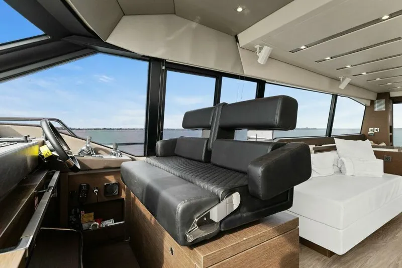 Be As You Are Xl Yacht Photos Pics Luxurious interior of 2017 Prestige 680 Flybridge yacht with modern seating and panoramic windows.