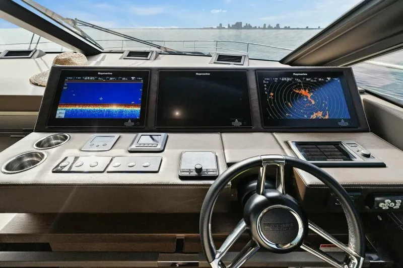 Be As You Are Xl Yacht Photos Pics Prestige 680 Flybridge 2017 yacht helm with navigation screens and steering wheel, overlooking the ocean.