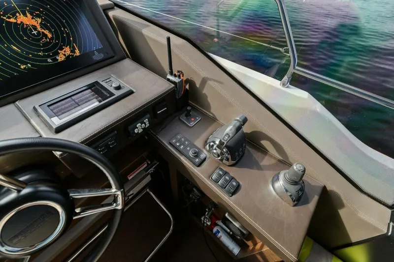 Be As You Are Xl Yacht Photos Pics Helm of 2017 Prestige 680 Flybridge yacht with navigation controls and radar display.