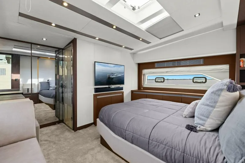 Be As You Are Xl Yacht Photos Pics Luxurious bedroom interior of 2017 Prestige 680 Flybridge yacht with modern design and large windows.