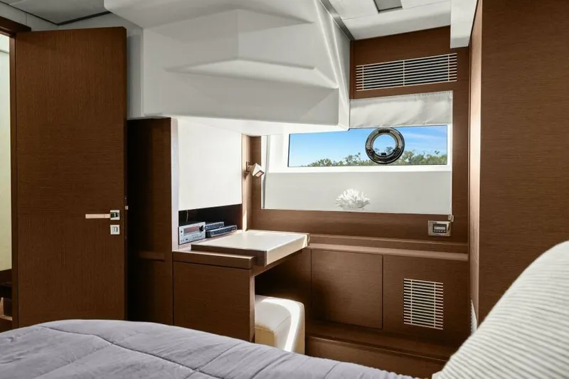 Be As You Are Xl Yacht Photos Pics Luxurious interior of 2017 Prestige 680 Flybridge yacht with modern wood finishes and porthole window.