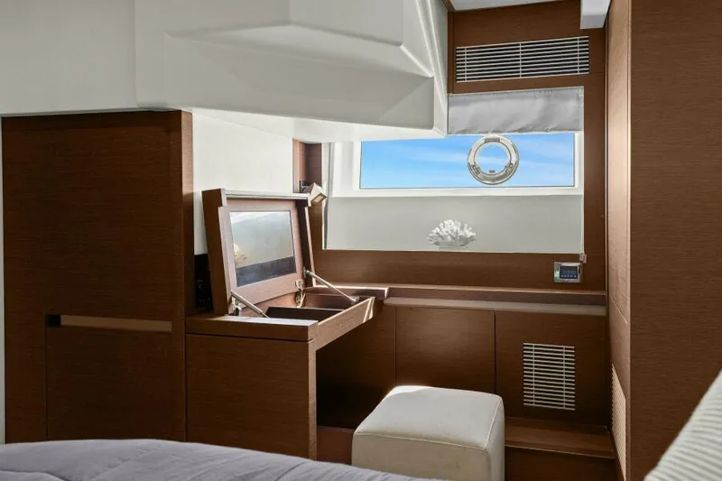 Be As You Are Xl Yacht Photos Pics Luxurious interior of 2017 Prestige 680 Flybridge yacht with elegant wood finish and window view.