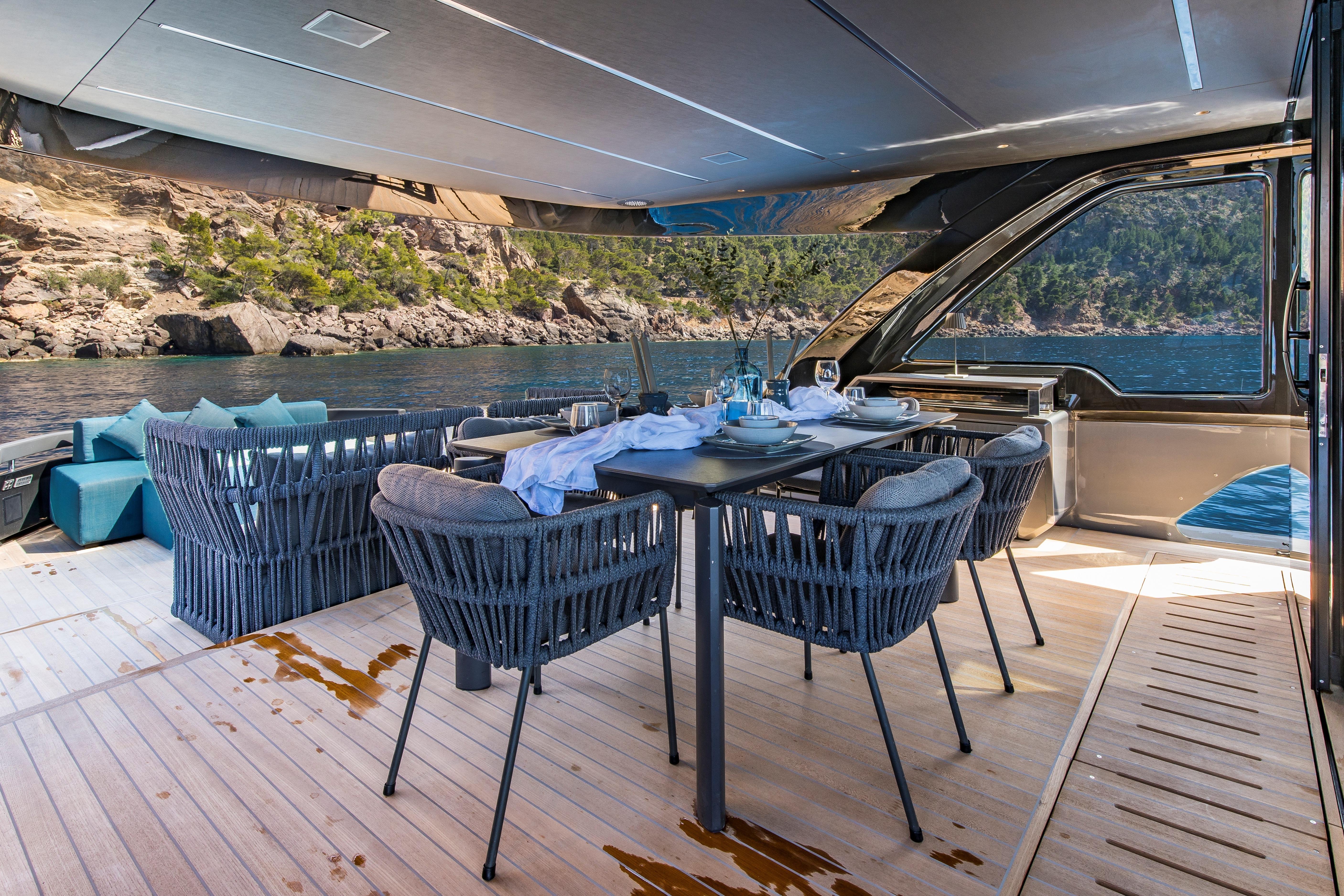 Luxurious 2024 Explorer EX62 yacht dining area with ocean view and elegant seating.