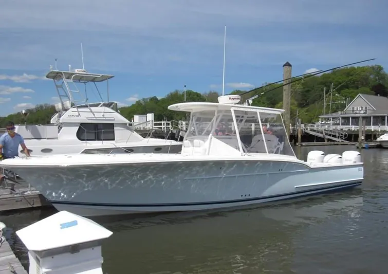  Yacht Photos Pics 2017 Buddy Davis 34 Center Console boat docked at a marina, clear sky background.